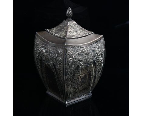 A Victorian silver tea caddy, shaped square form with relief embossed floral decoration and flame finial, by Hilliard & Thoma