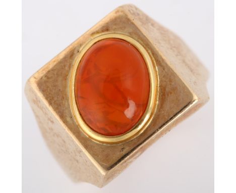 A late 20th century fire opal signet ring, heavy unmarked gold settings with oval cabochon fire opal, opal measures: 11.08mm 