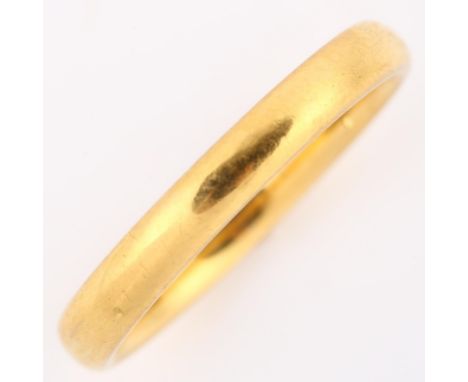 An early 20th century 22ct gold wedding band ring, maker's marks JM, hallmarks Birmingham 1934, band width 2.9mm, size M, 3.4