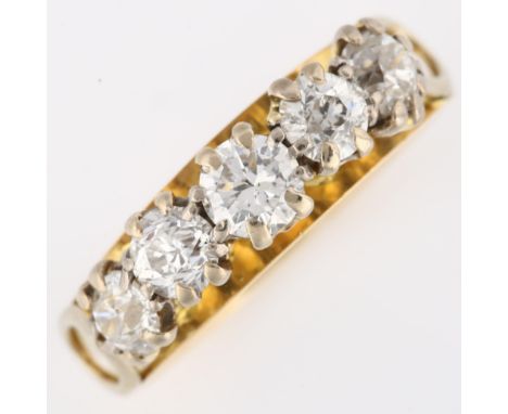 An 18ct gold five stone diamond ring, set with modern round brilliant and old European-cut diamonds, total diamond content ap