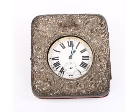 A nickel plated Goliath timepiece, in silver-fronted leather travelling case, white enamel dial with Roman numeral hour marke