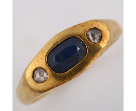 A heavy three stone sapphire and diamond ring, unmarked gold settings with oval mixed-cut sapphire and rose-cut diamonds, set