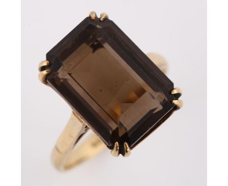 A mid-20th century 9ct gold smoky quartz dress ring, set with rectangular step-cut quartz, hallmarks Birmingham 1968, setting