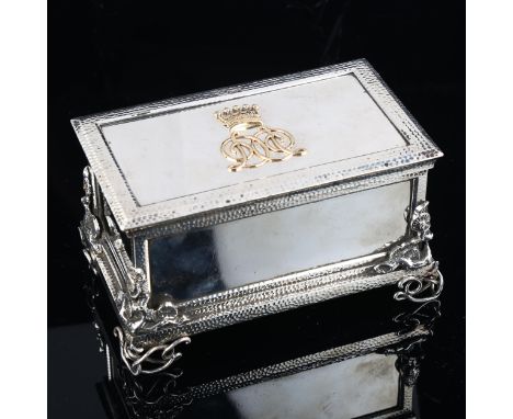 A fine quality Victorian cast-silver and gold desk casket, rectangular form, with hand planished decoration, blossom mounts a