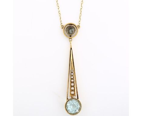 An Edwardian 15ct gold aquamarine and pearl openwork pendant necklace, on 15ct fine cable link chain, pendant height 45.1mm, 