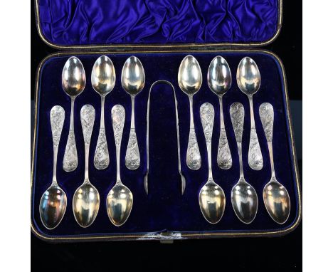 A cased set of 12 Victorian Aesthetic Movement silver teaspoons and pair of sugar tongs, with relief kingfisher decoration an