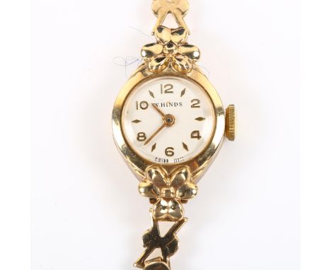 W HINDS - a lady's 9ct gold mechanical bracelet watch, silvered dial with gilt eighthly Arabic numerals and 9ct bracelet, 17 