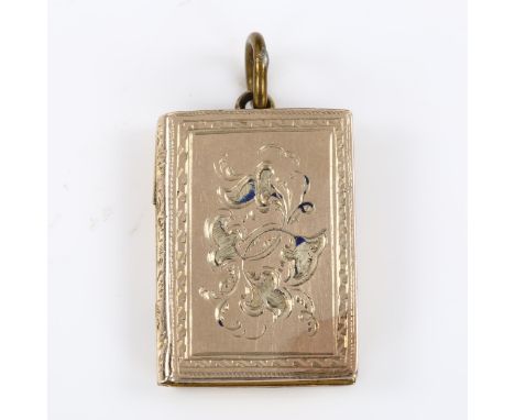 An unusual Victorian novelty book photo locket pendant, unmarked yellow metal settings with engraved floral decoration, penda