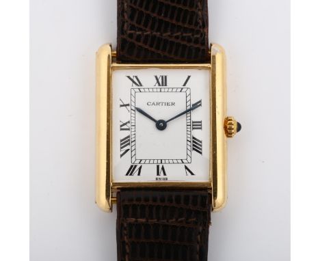 CARTIER - a mid-size 18ct gold Tank quartz wristwatch, white enamel dial with Roman numeral hour markers and blued steel hand