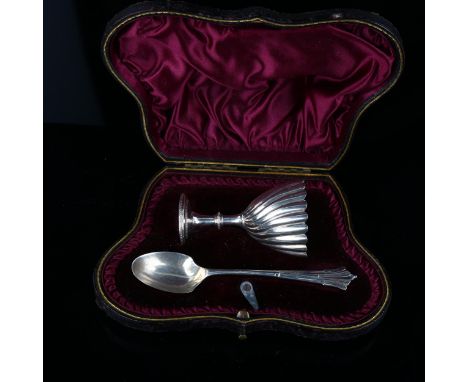 A Victorian silver egg cup and spoon set, twisted fluted decoration, indistinct maker's marks, hallmarks London 1894, cup hei