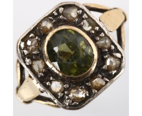 An Antique green stone and diamond cluster ring, unmarked gold and silver settings with oval mixed-cut green stone and rose-c