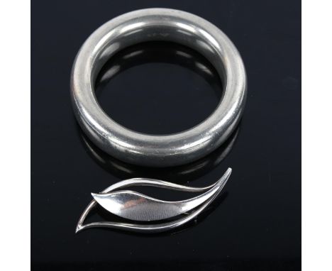 JUST ANDERSEN - a Danish stylised sterling silver leaf brooch, model no. 742, and a large pewter slave bangle, internal diame