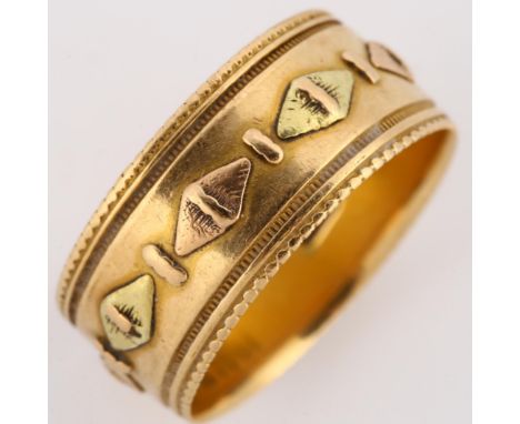 A 19th century 18ct two-colour gold wedding band ring, with raised lozenge decoration and engraved border, maker's marks CYBS