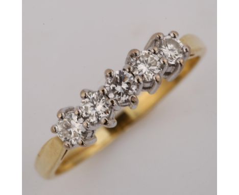 A modern 9ct gold five stone diamond ring, setting height 4.3mm, size K, 2.1gNo damage or repair, all stones present, diamond