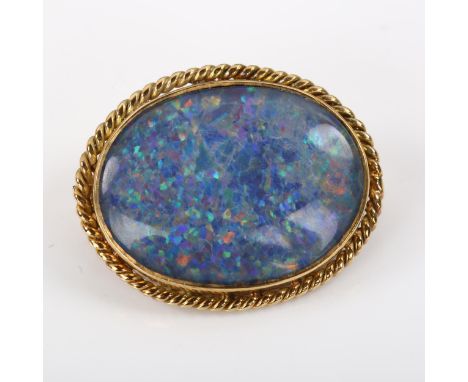 A late 20th century 9ct gold opal doublet brooch, with rope twist surround, hallmarks London 1978, brooch length 23.7mm, 4.5g