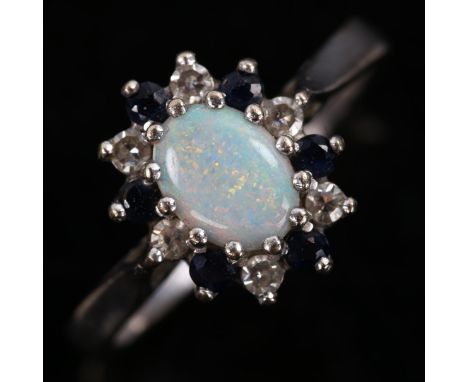 A late 20th century 18ct white gold opal sapphire and diamond cluster ring, set with oval cabochon opal and round-cut sapphir