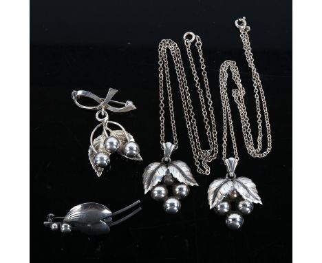 4 Danish silver floral brooches and pendants, makers include Niels Erik From pendant height 34.5mm, 27.1g total (4)No damage 