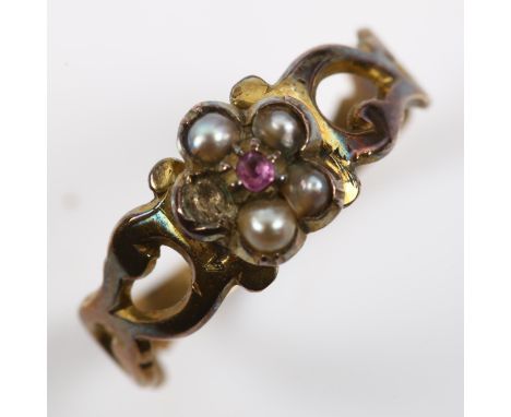 A Victorian garnet and pearl flowerhead cluster ring, unmarked gold closed-back settings, setting height 6.9mm, size H, 1gNo 