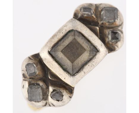 A 17th century diamond ring, the central closed set table-cut diamond in square silver mount with table-cut diamond three sto