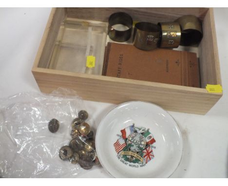 A BOX OF MILITARY RELATED COLLECTABLES TO INCLUDE BUTTONS, NAPKIN RINGS, CIGARETTE CASES ETC. 