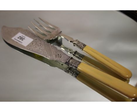 A HALLMARKED SILVER BONE HANDLED FISH KNIFE AND FORK 