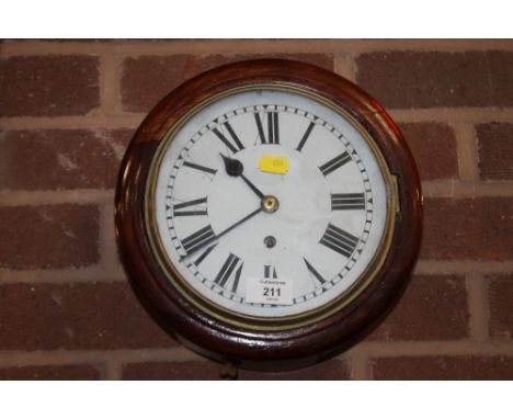 A VINTAGE CIRCULAR MAHOGANY WALL CLOCK