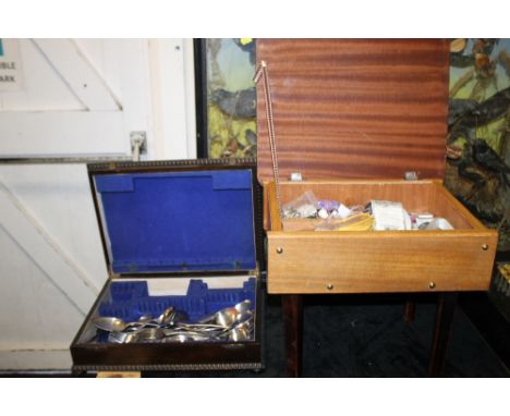 AN OAK CASED CANTEEN OF CUTLERY TOGETHER WITH A VINTAGE SEWING BOX AND CONTENTS