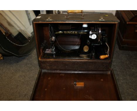 A CASED VINTAGE SINGER SEWING MACHINE
