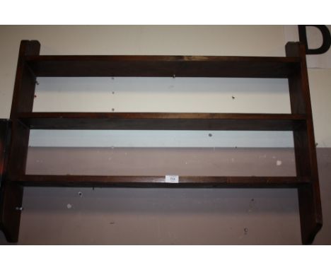 A VINTAGE STAINED PINE THREE SHELF WALL RACK