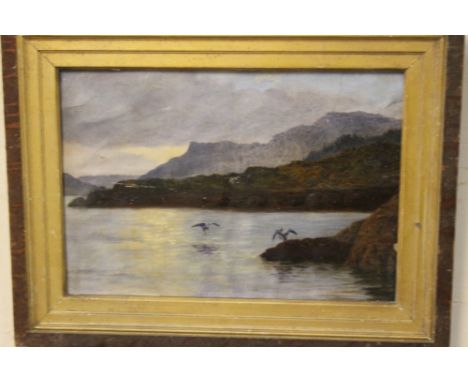 A GILT FRAMED OIL ON CANVAS DEPICTING A MOUNTAINOUS SEASCAPE WITH BIRDS 