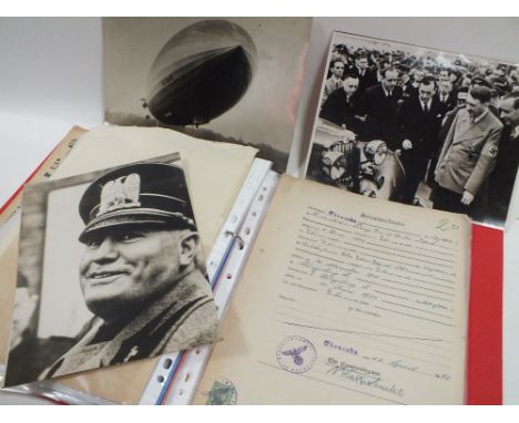 A FOLDER ON GERMAN / NAZI EPHEMERA TO INCLUDE POST CARDS, LETTERS, IMAGES OF A ZEPPELIN, NEWSPAPER ETC. 