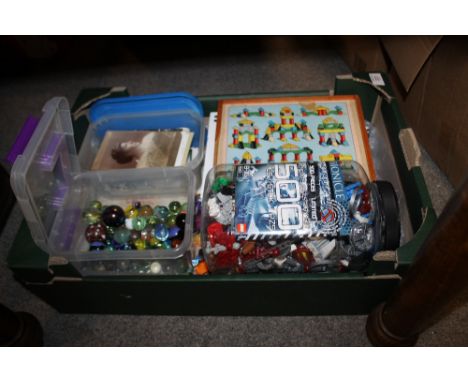 A TRAY OF TOYS AND POSTCARDS TO INCLUDE A BUILDING BLOCK SET, VINTAGE MARBLES ETC