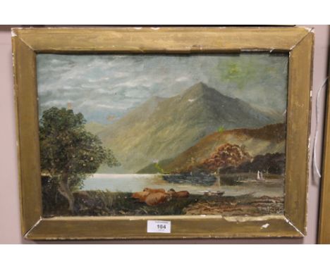A VINTAGE GILT FRAMED OIL ON CANVAS ON A MOUNTAINOUS LAKE SCENE WITH SHEEP SIGNED C WELL