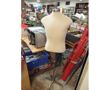 A MALE TORSO MANNEQUIN ON ADJUSTABLE METAL STAND