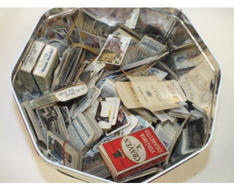 A TIN OF VINTAGE CIGARETTE CARDS 