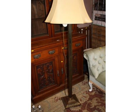 A NEO CLASSICAL STYLE BRASS STANDARD LAMP