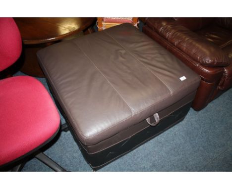 A LEATHER EFFECT POUFFE / FOLD OUT BED