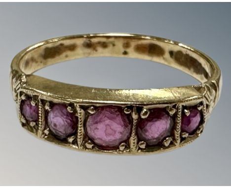 A 9ct gold five stone ruby ring, R½, 3.1g.