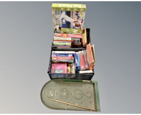 Two crates containing a large quantity of 20th century puzzles, boxed organ, board games, bagatelle board etc.