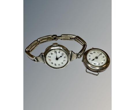 Two vintage silver watches one on silver strap.