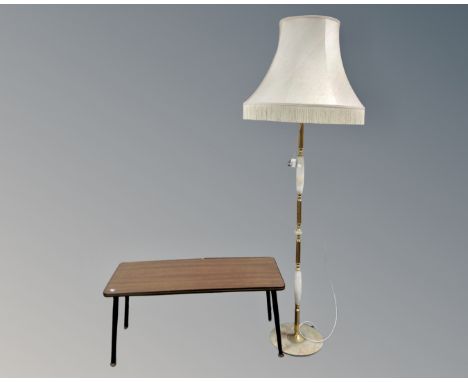 A 20th century melamine topped coffee table together with an onyx and brass effect standard lamp with shade.