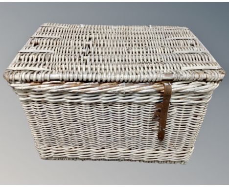 A vintage painted wicker hamper.