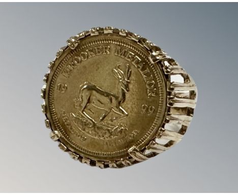 A 9ct yellow gold 1999 Republic of Futoria Krooker Metalior coin ring, 5.2g, size M.