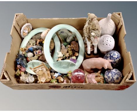 A box containing a pair of English ceramic oval frames, animal ornaments, blue and white porcelain.