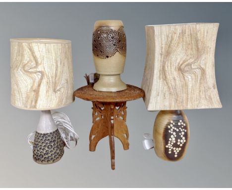 A group of three West German pottery lamp bases together with an Eastern small circular occasional table.