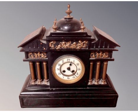 A Victorian slate and gilt metal mantel clock.