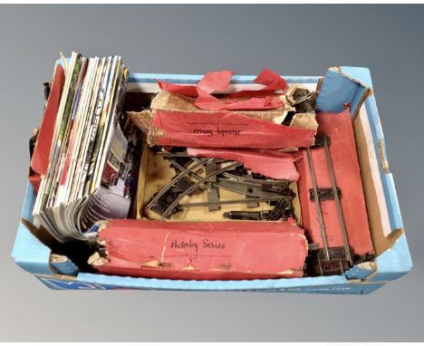 A box of vintage Hornby tin plate track in original boxes together with a small quantity of classic bus magazines 
