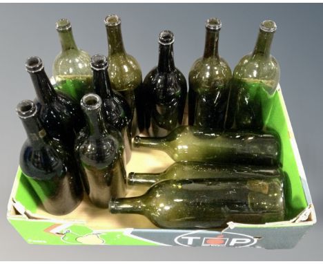 A box of twelve vintage wine bottles 