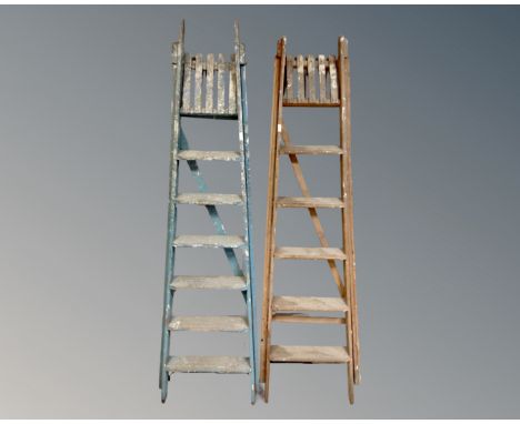 Two sets of vintage folding steps.