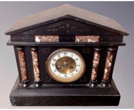 A Victorian slate and marble mantel clock.